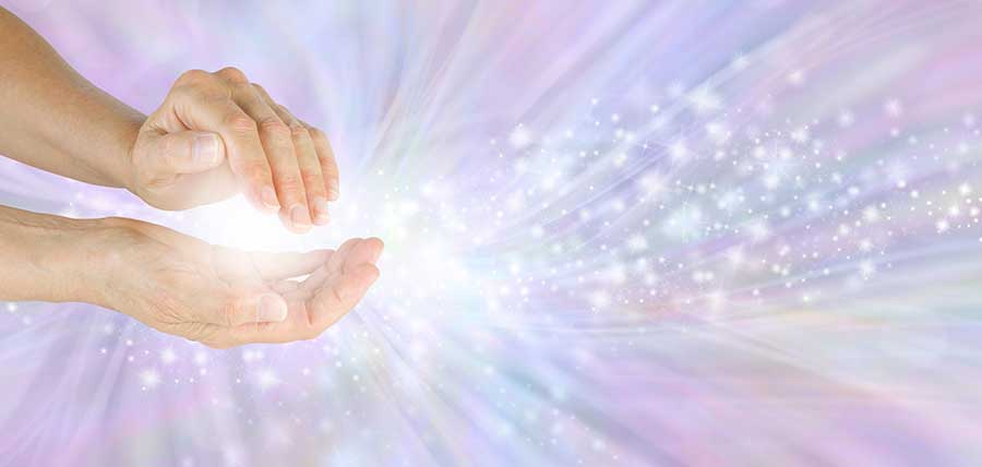 Reiki Healing - two hand cupped together showing a representation of reiki energy between the them